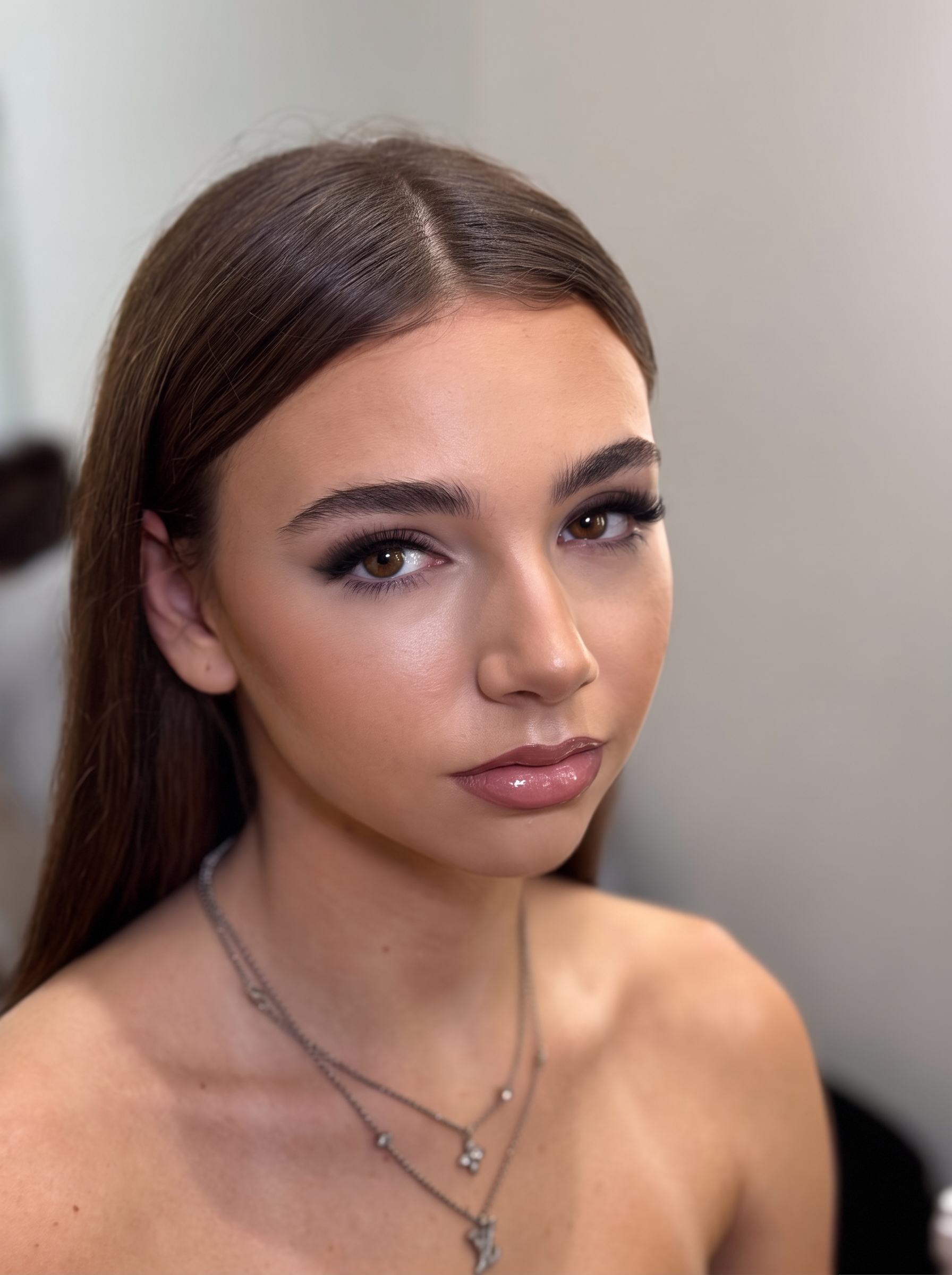 Soft smoky glam makeup with lifted lashes and groomed brows